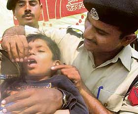 A BSF jawan administers polio drops to a child in Mohali