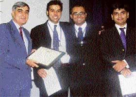 Mr Justice S.S. Nijjer presents an award to the winning team from Gujrat National University in the Stetson International Environment Moot Court Competition at Mohali