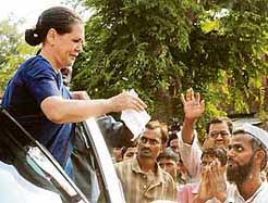 Congress president Sonia Gandhi interacts with villagers in Rae Bareli district on Sunday.