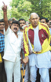 Former international wrestler Master Chandgi Ram with BJP activists participating in a protest march against the sealing of akharas and gyms at Parliament Street in the Capital on Tuesday.