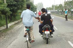 TRAFFIC HAZARD: It is not rare of seeing people showing scant respect for traffic rules and posing threat to others. This was one such sight near the PAP lights near Jalandhar.