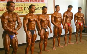 Body builders show their muscles during trials to select the Indian team for the Asian Games 2006 in Jalandhar on Sunday.