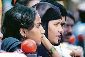 Relatives of an accused in the 1993 Bombay Stock Exchange bomb blast wait outside the TADA Court in Mumbai