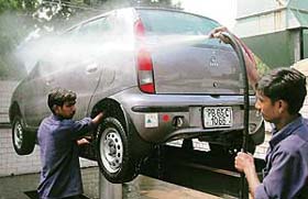 A car being washed at a service station in Chandigarh