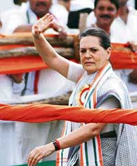 Congress president Sonia Gandhi waves to party workers at the 'Nav Nirman rally at Bareilly on Wednesday. 