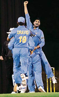 Harbhajan Singh is hugged by team-mates after he took a wicket during Indias tri-series ODI match against the West Indies in Kuala Lumpur on Wednesday.