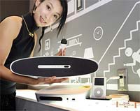 Japan's electronics giant Pioneer employee displays a prototype model of new audio system "Music Tap" at an audio exhibition in Yokohama, near Tokyo, on Thursday.