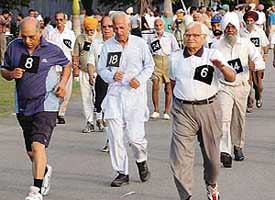 Senior citizens take part in a brisk walk held at Sukhna Lake in Chandigarh