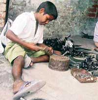 Hammer, not the pen, will help me earn my livelihood, says Mangal Dass, while hammering a sickle at Ahmedgarh.