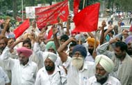 Members of various labour organisations protest against police high-handedness on students on the university campus, Ludhiana, on Friday