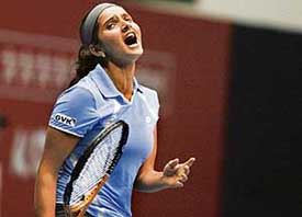 Sania Mirza reacts during a quarterfinal match against Aravane Rezai of France during the Sunfeast Open on Friday