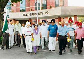 Senior citizens take part in a walk as part of World Heart Day celebrations at the Fortis Hospital in Mohali