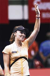 Martina Hingis of Switzerland celebrates after beating unseeded Russian Olga Poutchkova in the final of the Sunfeast Open in Kolkata on Sunday