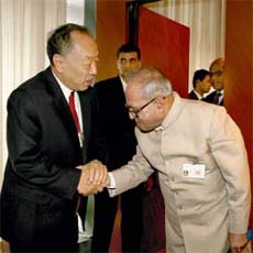 Defence Minister Pranab Mukherjee greets Chinese Foreign Minister Li Zhaoxing prior to their bilateral meeting at the UN Headquarters in New York