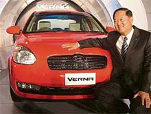 Mr H.S. Lheem, MD, Hyundai Motor India, poses with the newly launched Hyundai Verna car in New Delhi on Monday.