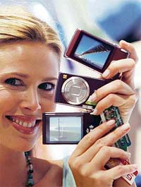 A model displays Panasonic Lumix FX05 camera on Monday, a day before the opening of the Photokina 2006 World Fair for Imaging in Cologne.