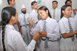 Students of Khosla Deaf School communicate with each other using sign language in Jalandhar