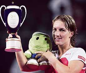 Russias Svetlana Kuznetsova lifts the trophy after beating Amelie Mauresmo of France in the final of the China Open in Beijing on Sunday