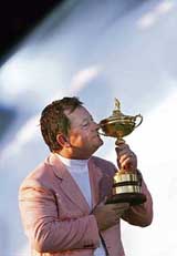 European Ryder Cup captain Ian Woosnam kisses the Ryder Cup trophy after Europe beat the USA at the K Club in Straffan, Ireland, on Sunday