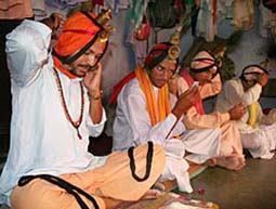 A group pf Jangams get ready before going out to collect donations by singing Shiv Katha in Amritsar. 
