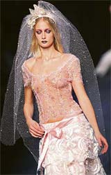 A model presents a creation by Italian designer Mariella Burani at the Spring/Summer 2007 collection in Milan on Wednesday.
