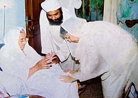 Ms Gursharan Kaur, wife of Prime Minister Manmohan Singh, receives blessings from Bibi Ranjit Kaur, wife of late Sant Waryam Singh, in Mohali