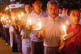 Members of the regional Tibetan Youth Congress, Chandigarh, take out a candle light vigil from Panjab University, Chandigarh
