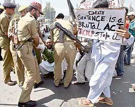The police detains JKDLP activists, who were protesting against the death sentence to Afzal Guru, in Srinagar on Thursday