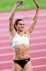 World record holder Yelena Isinbayeva of Russia rejoices after winning the womens pole vault event at the Daegu Athletics Meet in South Korea on