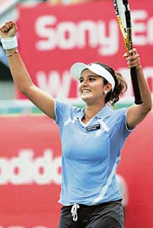Sania Mirza celebrates after defeating Martina Hingis in the second round of the Hansol Korea Open tennis championship in Seoul