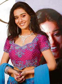 Bollywood actress Amrita Rao wears a necklace at the launch of D'damas diamond jewellery in New Delhi on Friday.