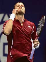 Russias Marat Safin celebrates after defeating Germanys Mischa Zverev in the quarterfinal of the Thailand Open tennis tournament in Bangkok on Friday