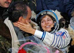 US entrepreneur Anousheh Ansari and her husband Hamid smile shortly after landing near the town of Arkalyk, northern Kazakhstan, on Friday. 