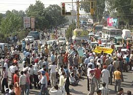 Members of the Computer Teachers Union (contractual), Punjab, hold a protest at the PAP junction, demanding regularisation and increase in salaries in Jalandhar on Saturday.