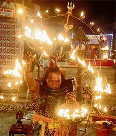 A man balances 501 diyas (earthen lamps) during the Navratri celebrations in Ahmedabad