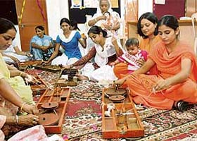 Students of the Dev Samaj College of Education, Sector 36, try their hands at the charkha on the eve of Gandhi Jayanti in Chandigarh