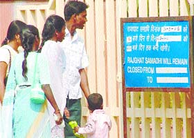 A family visiting Rajghat looks aghast at a notice board denying public access to the samadhi of the leader of the masses, Mahatma Gandhi, on the occasion of Gandhi Jayanti, for the benefit of visiting leaders and dignitaries