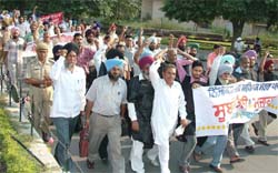 Members of the Nijikaran Virodhi Adhiapak Morcha, Punjab, during a protest march in Jalandhar on Sunday.