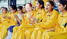 Girl participants cheer fellow athletes at the function.