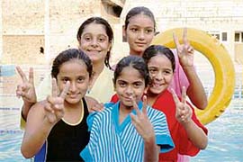 Jaspneet Kaur, Kawalpreet Kaur, Chiranjiv and Arman Kaur, members of the team which won the 100 m x 4 freestyle event at the Ludhiana District Swimming Championship on Sunday.