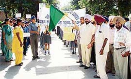 Mr Sadhu Singh Dharamsot, Parliamentary Secretary Home, flags off a march by the scouts and guides of various schools at Amloh on Saturday.
