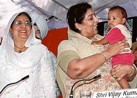 Union Minister for Women and Child Development Renuka Chowdhury with a child at Lehra Gaga during a function on Friday.
