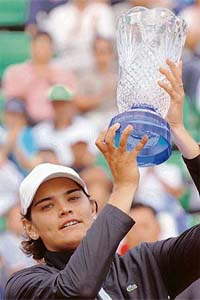 Greeces Eleni Daniilidou holds the trophy after defeating Japans Ai Sugiyama in the final of the Korea Open tennis tournament in Seoul