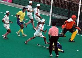 Players of Namdhari XI and Bharat Petroleum Corporation Limited in action during the semifinal of the SN Vohras 36th All-India Gurmit Memorial Hockey Tournament