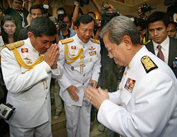 Thailand's interim Prime Minister Surayud Chulanont (right) greets Thai coup leader Gen Sonthi Boonyaratglin at Government House in Bangkok on Sunday.
