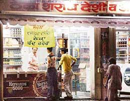 A liquor vend that was open till midnight on Sunday while a banner on the shop read, "The vend would remain closed tomorrow in view of Dasehra".