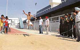 An athlete in action during a long jump event on the second day of the third National Athletics Meet for the Blind at Guru Nanak Stadium, Ludhiana, on Monday.