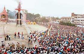 Crowds gather around an effigy of Ravana as it goes up in flames in Ludhiana on Monday. 
