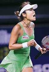 Japans Akiko Morigami reacts as she gets a point during the first round match against Russian Maria Kirilenko at the Japan Open tennis tournament in Tokyoon Monday. Morigami won 1-6, 6-2, 7-6.