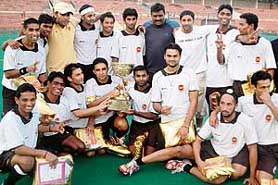 Players of Indian Oil Corporation pose with the trophy after defeating Bharat Petroleum Corporation Limited in the final of SN Vohras 36th All-India Gurmit Memorial Hockey Tournament at the Sector 42 hockey stadium in Chandigarh on Monday.